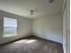 Spacious bedroom featuring carpet flooring, a window, and ample natural light at 2030 Sw 163Rd Pl, Ocala, FL 34473