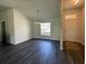 Bright dining room features gray vinyl plank flooring and a view to the backyard at 2030 Sw 163Rd Pl, Ocala, FL 34473