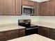 Modern kitchen with stainless steel appliances and granite countertops at 2030 Sw 163Rd Pl, Ocala, FL 34473