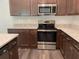 Modern kitchen with stainless steel appliances and granite countertops at 2030 Sw 163Rd Pl, Ocala, FL 34473
