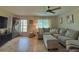 Cozy living room with L-shaped sectional sofa and large window at 730 Ne 18Th Ave, Ocala, FL 34470