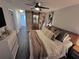 Main bedroom with king bed, barn door, and ensuite bathroom at 730 Ne 18Th Ave, Ocala, FL 34470