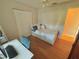 Small bedroom with a twin bed, built-in closet and workspace at 730 Ne 18Th Ave, Ocala, FL 34470