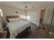 Main bedroom with a king-size bed and en-suite bathroom access at 730 Ne 18Th Ave, Ocala, FL 34470