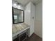 Bathroom features a vanity with a vessel sink and tall cabinets at 730 Ne 18Th Ave, Ocala, FL 34470
