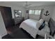 Main bedroom with king-size bed and en-suite bathroom access at 730 Ne 18Th Ave, Ocala, FL 34470