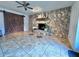 Living room featuring a stone fireplace and barn door at 730 Ne 18Th Ave, Ocala, FL 34470