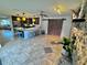 Open kitchen with island, stainless steel appliances, and tile floors at 730 Ne 18Th Ave, Ocala, FL 34470