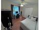 Bedroom with a double bed, built-in closet, and a home office setup at 730 Ne 18Th Ave, Ocala, FL 34470