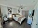 Spacious main bedroom with a king-size bed and barn door at 730 Ne 18Th Ave, Ocala, FL 34470