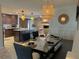 Open concept dining area with kitchen and stone fireplace views at 730 Ne 18Th Ave, Ocala, FL 34470