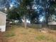 Spacious backyard with mature trees and a fenced perimeter at 8685 Sw 67 Ct, Ocala, FL 34476