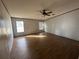Bright bedroom with wood flooring and ceiling fan at 8685 Sw 67 Ct, Ocala, FL 34476