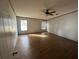 Spacious bedroom with wood flooring and ceiling fan at 8685 Sw 67 Ct, Ocala, FL 34476