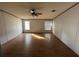 Spacious bedroom with wood-look floors and ceiling fan at 8685 Sw 67 Ct, Ocala, FL 34476