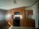 Cozy kitchen featuring wood cabinets and black appliances at 8685 Sw 67 Ct, Ocala, FL 34476