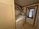 Practical laundry room with washer, dryer, and storage at 8685 Sw 67 Ct, Ocala, FL 34476