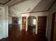 Built-in shelves in living area with hardwood floors at 8685 Sw 67 Ct, Ocala, FL 34476