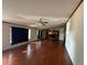 Large living room with hardwood floors and access to kitchen at 8685 Sw 67 Ct, Ocala, FL 34476