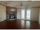 Living room with stone fireplace and hardwood floors at 8685 Sw 67 Ct, Ocala, FL 34476