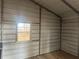 Interior of a metal workshop with tile floor and window at 8685 Sw 67 Ct, Ocala, FL 34476