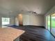 Spacious living room with sliding glass doors leading to the backyard at 2030 Sw 163Rd Pl, Ocala, FL 34473