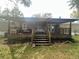 Large covered deck and partially fenced backyard at 8685 Sw 67 Ct, Ocala, FL 34476