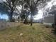 Partially fenced backyard with mature trees at 8685 Sw 67 Ct, Ocala, FL 34476