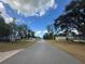 Landscaped community with mature trees and well-maintained homes at 8685 Sw 67 Ct, Ocala, FL 34476