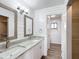 Double vanity bathroom with granite countertops and updated fixtures at 10335 Sw 92Nd Ct, Ocala, FL 34481