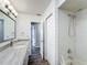 Renovated bathroom featuring a walk-in shower and updated vanity at 10335 Sw 92Nd Ct, Ocala, FL 34481