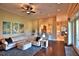 Open living room with a view of the kitchen and hardwood floors at 1525 Se 59Th St, Ocala, FL 34480