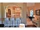 Breakfast bar and kitchen with white cabinets and granite countertops at 1525 Se 59Th St, Ocala, FL 34480