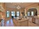 Open kitchen with large island, granite countertops, and stainless steel appliances at 1525 Se 59Th St, Ocala, FL 34480
