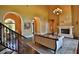 Open living space with hardwood floors, fireplace, and staircase at 1525 Se 59Th St, Ocala, FL 34480