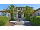 Two story house with palm trees and fountain at 1525 Se 59Th St, Ocala, FL 34480