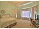 Bright bedroom with a queen-size bed and plenty of natural light at 1525 Se 59Th St, Ocala, FL 34480