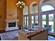 Bright living room with hardwood floors, fireplace, and multiple windows at 1525 Se 59Th St, Ocala, FL 34480