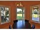 Charming breakfast nook with a round table and views of the backyard at 1525 Se 59Th St, Ocala, FL 34480