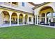 Expansive backyard with covered patio and lush green lawn at 1525 Se 59Th St, Ocala, FL 34480