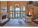 Spacious living area with hardwood floors, fireplace, and access to backyard at 1525 Se 59Th St, Ocala, FL 34480