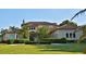 Mediterranean style home with tile roof, palm trees, and manicured landscaping at 1525 Se 59Th St, Ocala, FL 34480