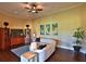 Spacious living room with hardwood floors, comfortable seating, and large windows at 1525 Se 59Th St, Ocala, FL 34480