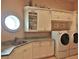 Bright laundry room with ample counter and cabinet space at 1525 Se 59Th St, Ocala, FL 34480