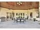 Spacious covered patio with a dining area, perfect for outdoor meals at 1525 Se 59Th St, Ocala, FL 34480
