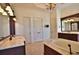 Spa-like bathroom with double sinks, a large soaking tub, and plenty of counter space at 1525 Se 59Th St, Ocala, FL 34480