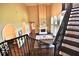 Grand staircase overlooking a spacious living area with hardwood floors at 1525 Se 59Th St, Ocala, FL 34480