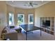 Game room featuring a ping pong table, comfortable seating, and built-in shelving at 1525 Se 59Th St, Ocala, FL 34480