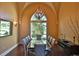 Formal dining room with large window, chandelier, and glass top table at 1525 Se 59Th St, Ocala, FL 34480