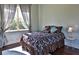Cozy bedroom with a queen-sized bed and ample natural light at 1525 Se 59Th St, Ocala, FL 34480